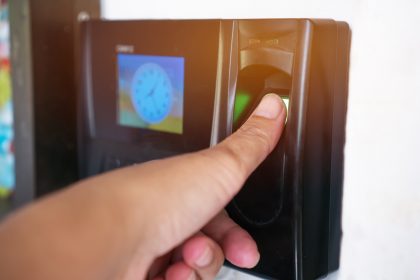 Fingerprint or Thumbprint scanner scan to record at working time in modern office. Easily deposited on suitable surfaces.