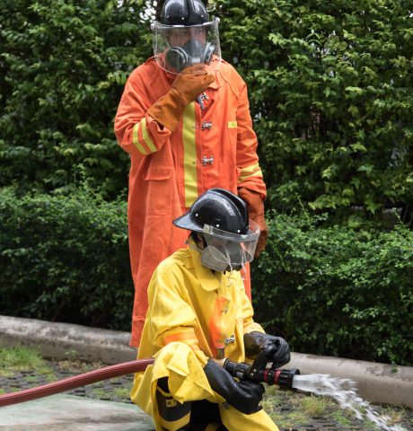 BANGKOK, THAILAND - JANUARY 27, 2018 Emergency Training of Fireman in Fire Fighting and Evacuation Fire Drill Simulation Training For Safety in Condominium